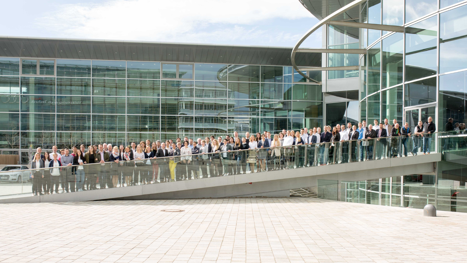 The 100 or so employees of Audi Consulting on a ramp outside the building in Ingolstadt.